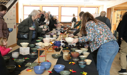 People go through the nearly 400 bowls made by Views Independent Potters