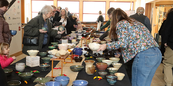 People go through the nearly 400 bowls made by Views Independent Potters 2x1 sm