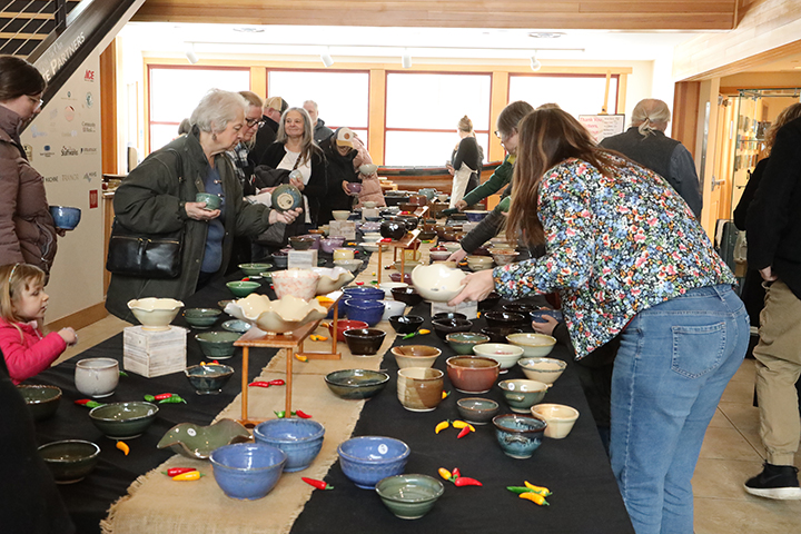 People go through the nearly 400 bowls made by Views Independent Potters sm